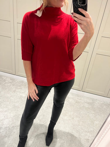 Red ribbed polo neck jumper